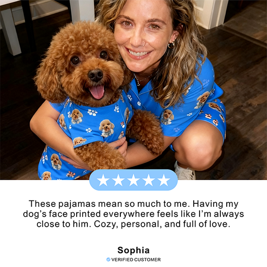 Woman wearing a blue pajama set with a dog's face printed on it, sitting on the floor with a brown dog.