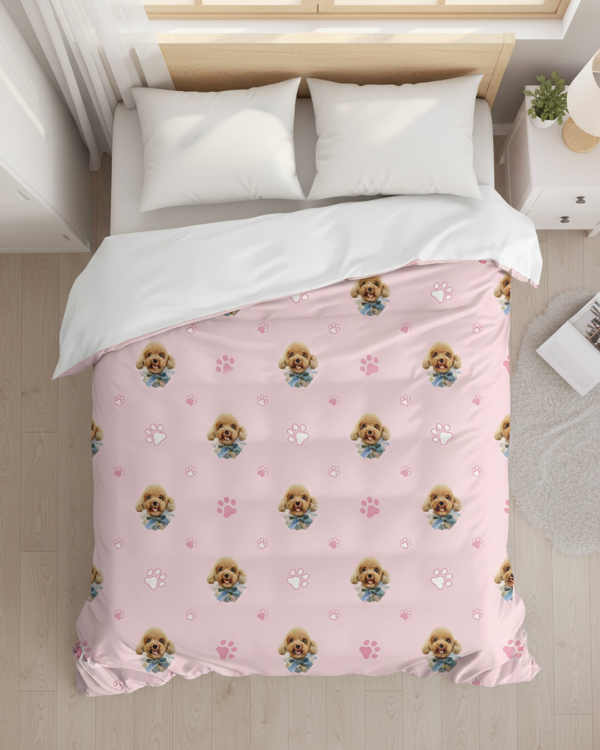 Pink bedspread with dog pattern on a neatly made bed in a bedroom.
