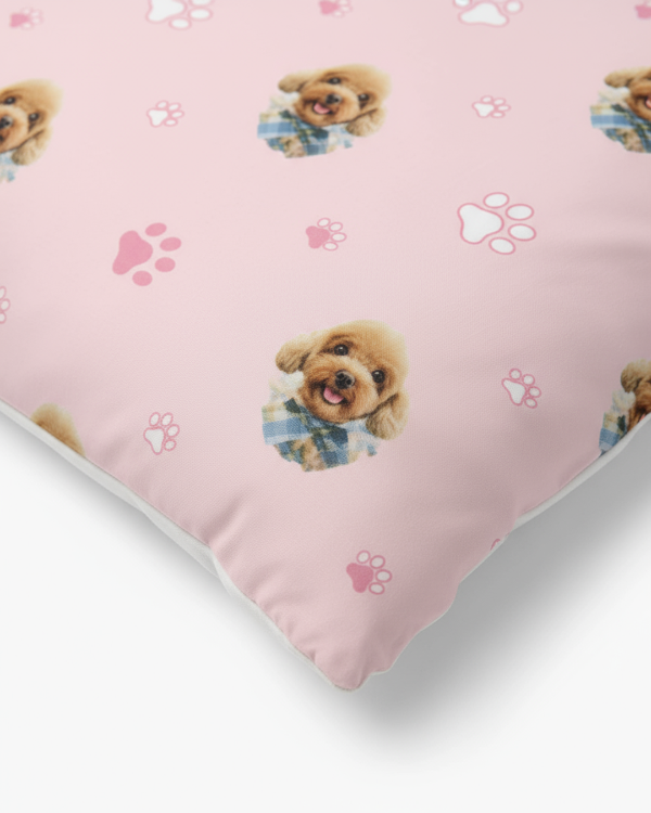 Pink fabric with dog illustrations and paw prints on a white background