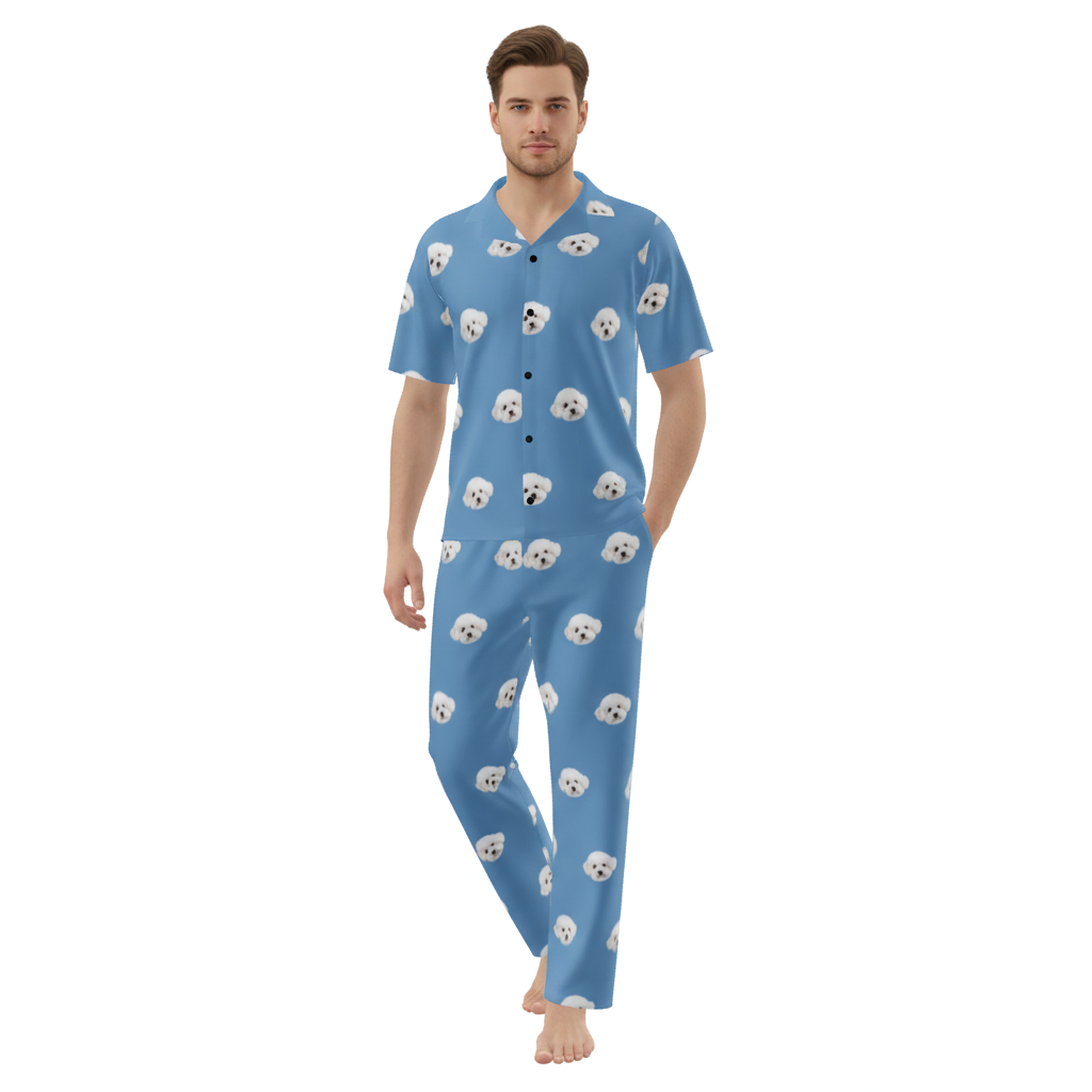 Man wearing a blue pajama set with dog pattern on a white background