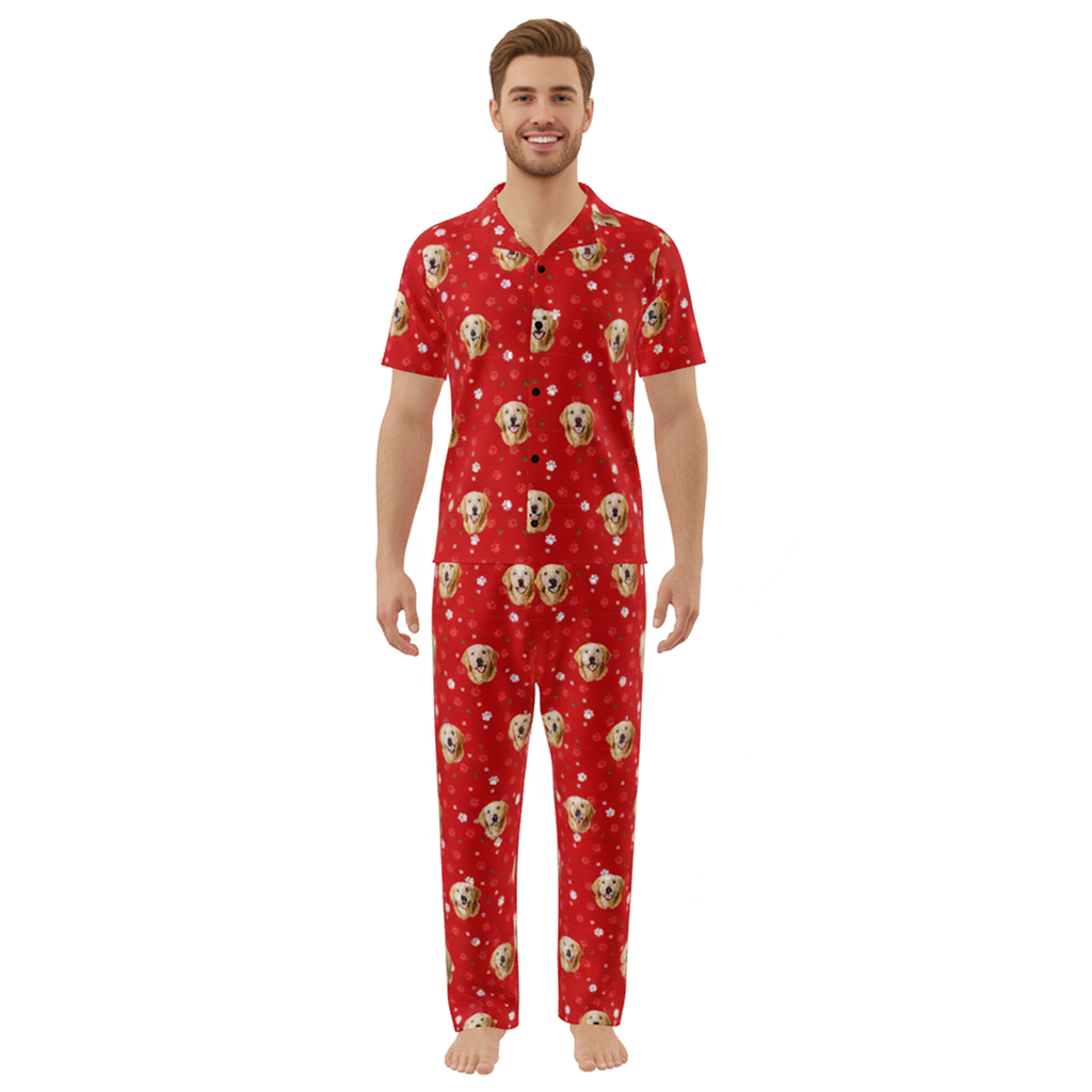 Man wearing a red pajama set with dog pattern on a white background