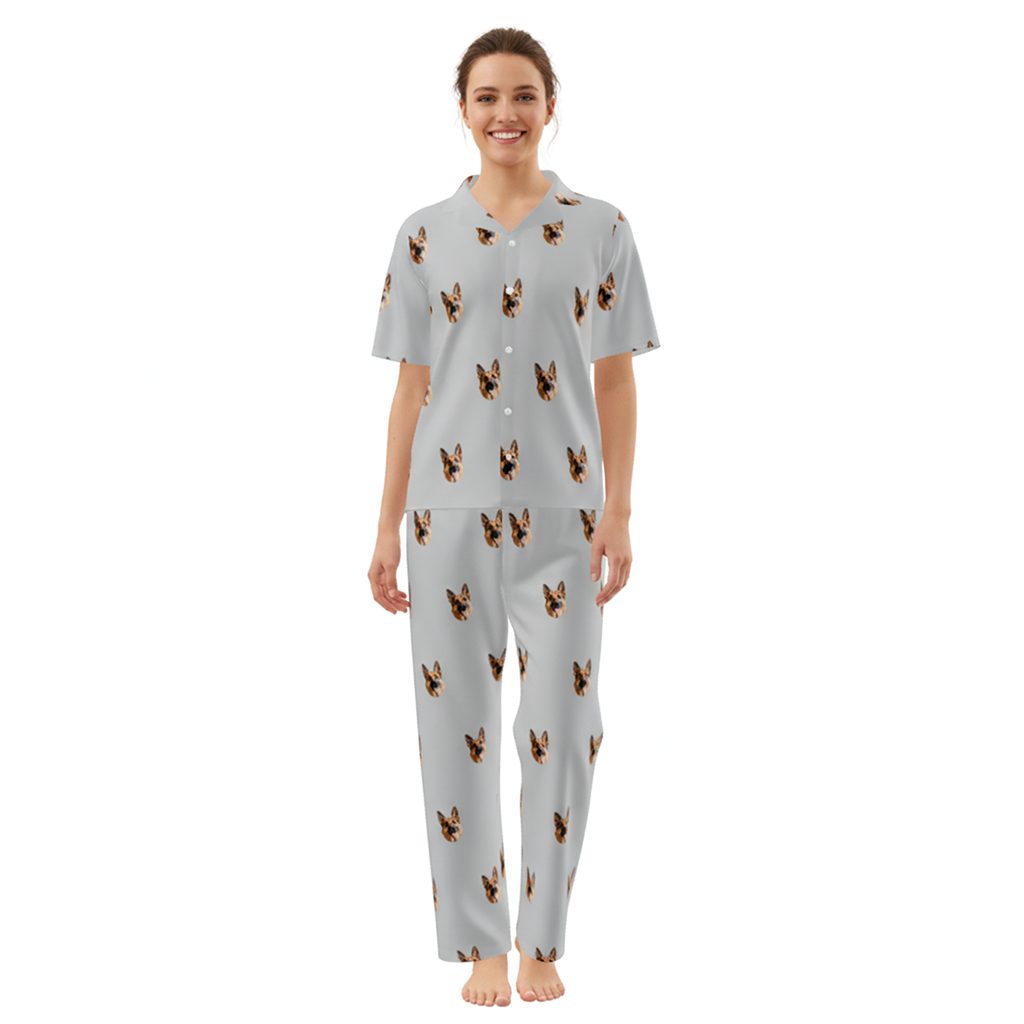 Woman wearing a light gray pajama set with dog pattern on a white background