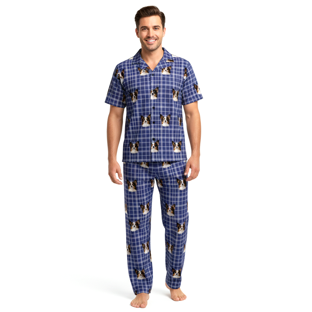 Man wearing blue plaid pajamas with dog pattern on a white background