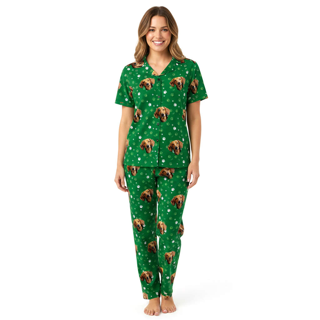 Woman wearing a green pajama set with dog pattern on a white background