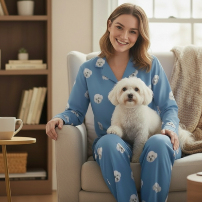 Custom Pet Face Pajama,Woman in blue pajamas with dog patterns sitting on a couch holding a small white dog.