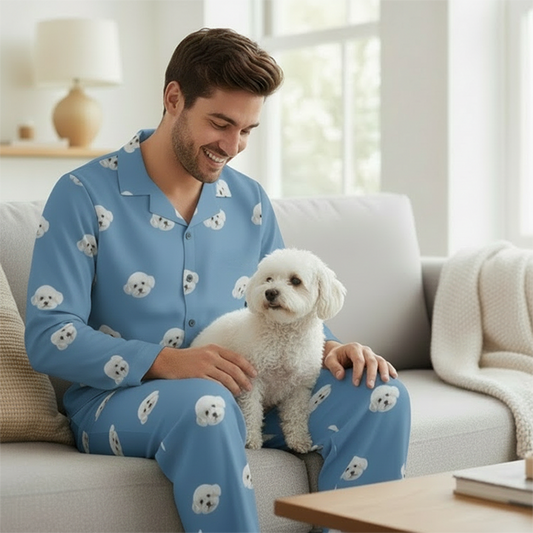 Custom Pet Face Pajama,Man in blue pajamas with dog patterns sitting on a couch holding a small white dog.