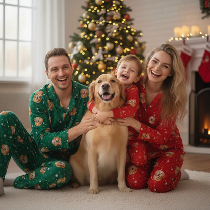 Family of three with a dog in matching pajamas in front of a Christmas tree.