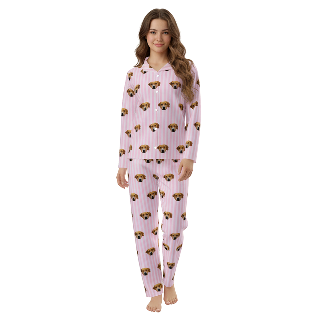 Woman wearing pink pajamas with dog pattern on a white background