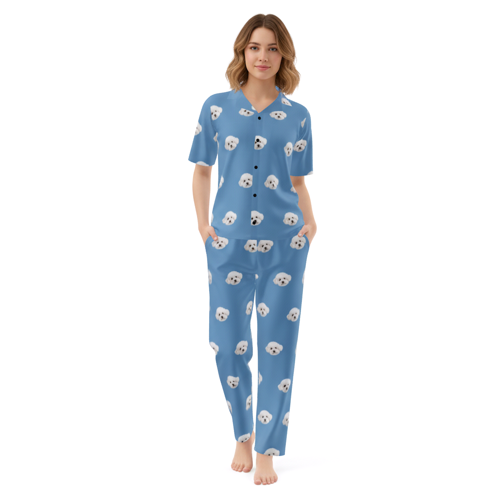Woman wearing blue pajamas with dog pattern on a white background