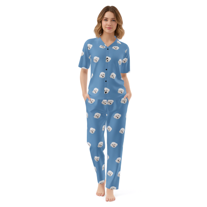 Woman wearing blue pajamas with dog pattern on a white background