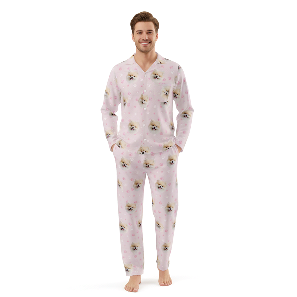 Man wearing a pink pajama set with dog pattern on a white background