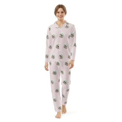 Woman wearing a pink pajama set with a pattern on a white background