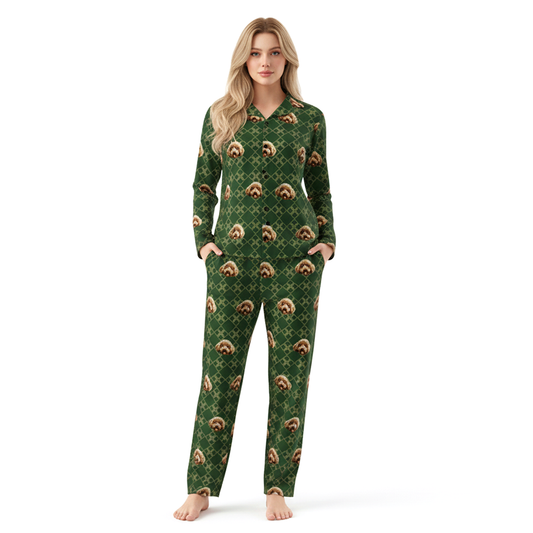 Woman wearing a green pajama set with sloth pattern on a white background