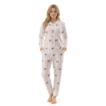 Woman wearing a checkered pajama set with cartoon characters on a white background