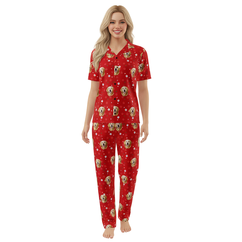 Woman wearing a red pajama set with dog pattern on a white background