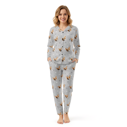 Woman wearing a gray pajama set with dog pattern on a white background
