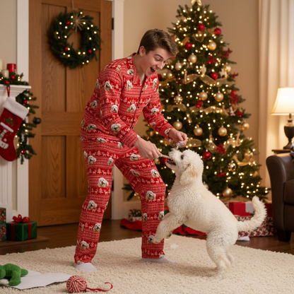 Man in red pajamas with a dog in a festive living room with Christmas tree and decorations.
