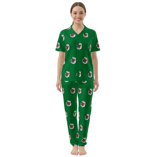 Woman wearing green pajamas with pug pattern on a white background