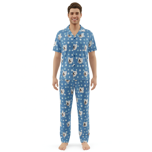 Man wearing a blue pajama set with animal pattern on a white background