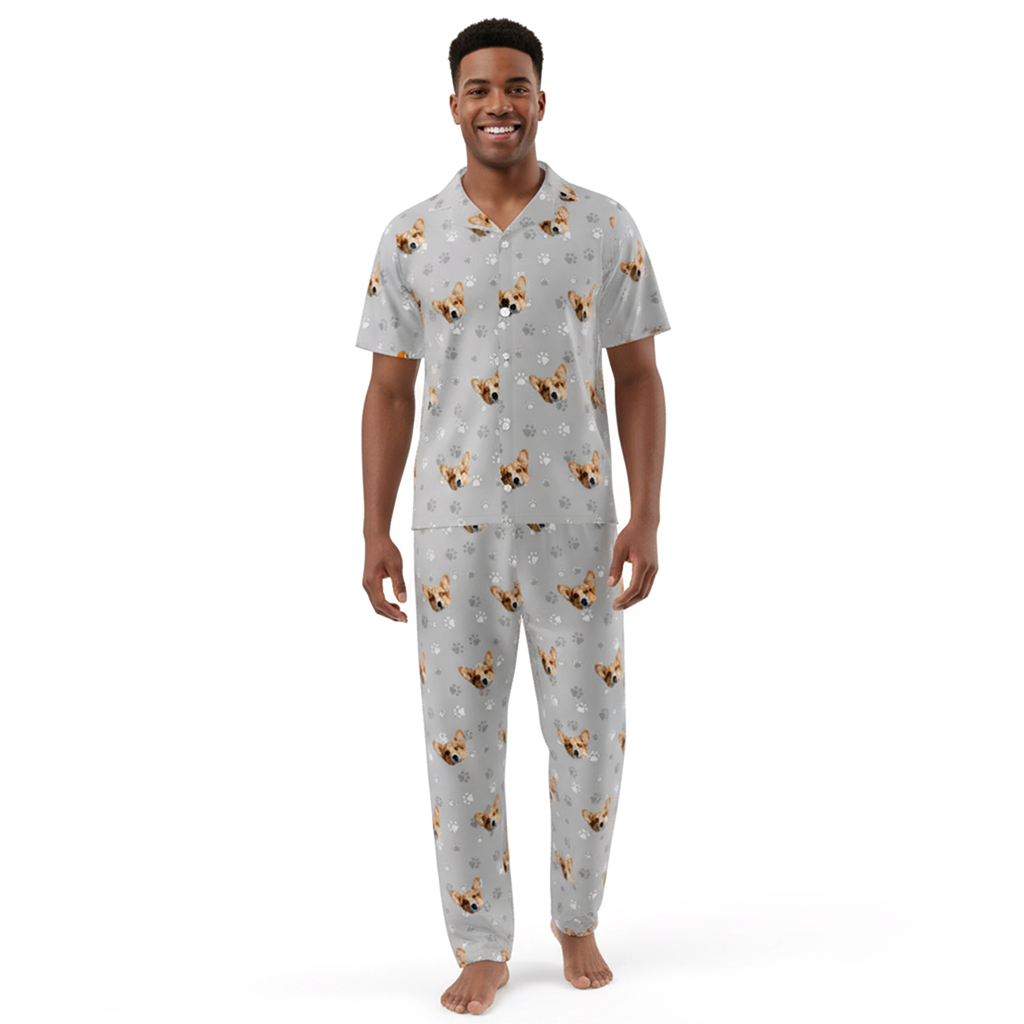 Man wearing a gray pajama set with dog pattern on a white background