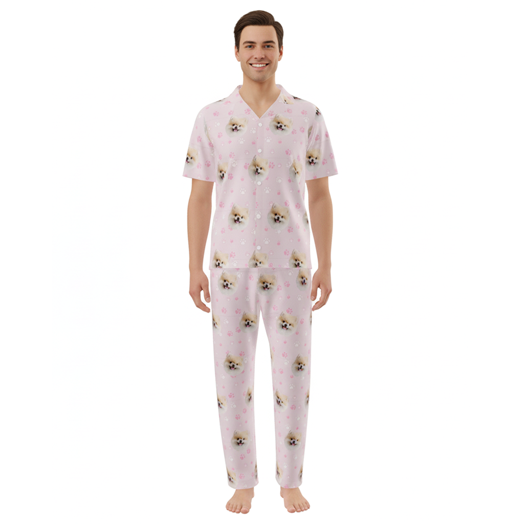 Man wearing pink pajamas with dog pattern on a white background